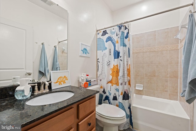 full bathroom featuring vanity, shower / bath combination with curtain, and toilet