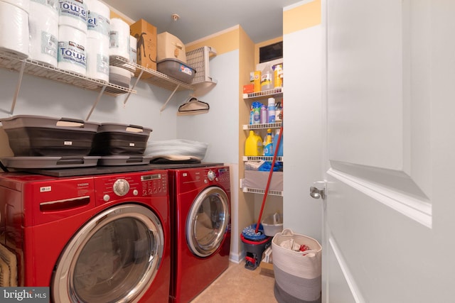 washroom with washing machine and clothes dryer