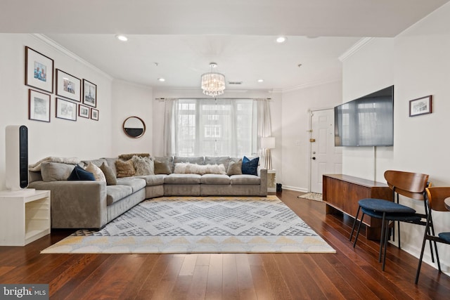 living room featuring a notable chandelier, crown molding, and dark wood-type flooring