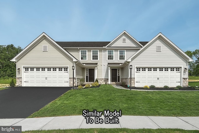 front of property featuring a garage and a front yard