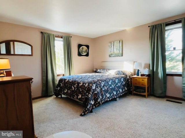 bedroom with light carpet