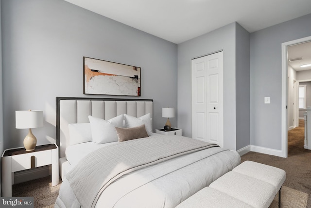 carpeted bedroom featuring a closet