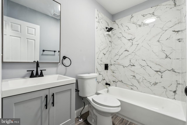 full bathroom featuring vanity, toilet, tiled shower / bath combo, and hardwood / wood-style floors