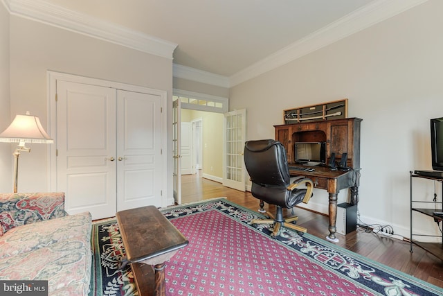 office with ornamental molding and hardwood / wood-style floors