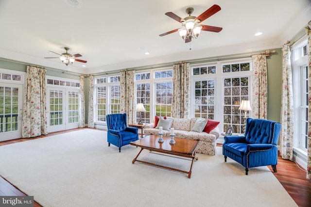 sunroom featuring a wealth of natural light and ceiling fan