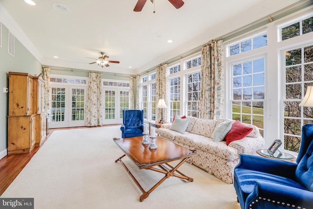 sunroom featuring a wealth of natural light and ceiling fan