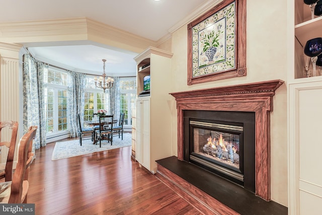 interior space featuring ornamental molding, dark wood-type flooring, and a notable chandelier