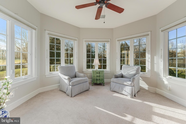 sunroom / solarium with ceiling fan