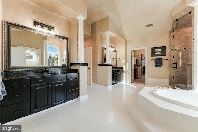 bathroom featuring vanity, separate shower and tub, and ornate columns