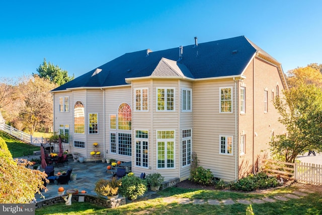 rear view of house featuring a patio