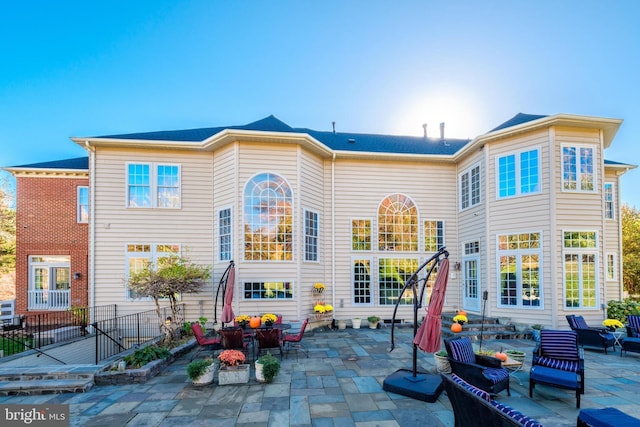 back of house with a patio area