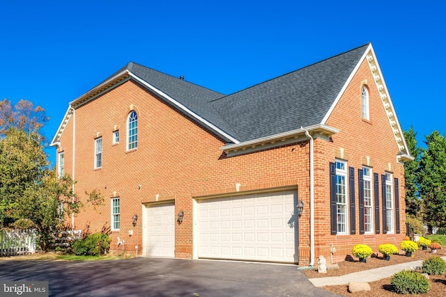 view of property exterior featuring a garage