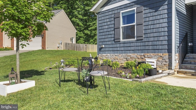 18075 Coolidge Ln, Bowling Green, VA 22427 - view of home's exterior featuring stone siding and a garage