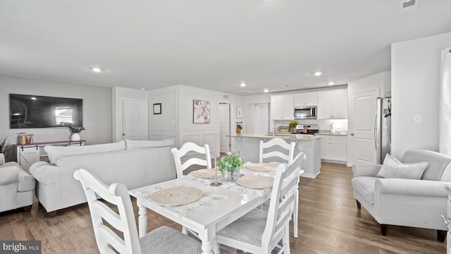 18075 Coolidge Ln, Bowling Green, VA 22427 - dining area with wood finished floors and recessed lighting