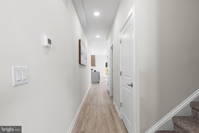 corridor featuring light hardwood / wood-style flooring