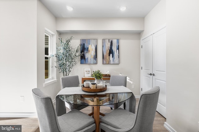 dining area with hardwood / wood-style floors