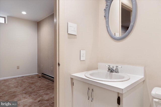 bathroom with a baseboard radiator and vanity