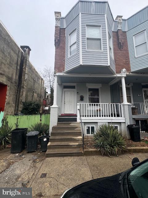 view of property with a porch