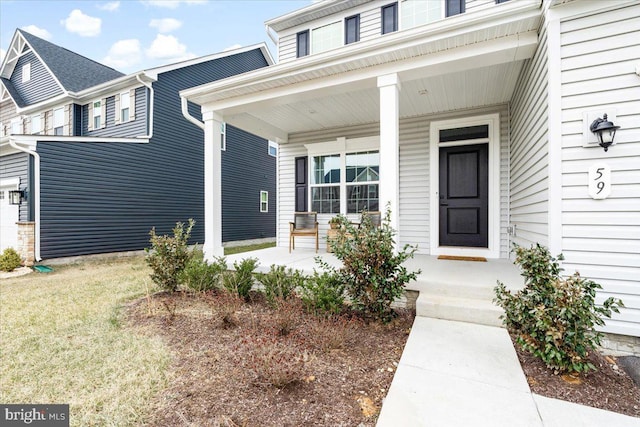 property entrance featuring covered porch