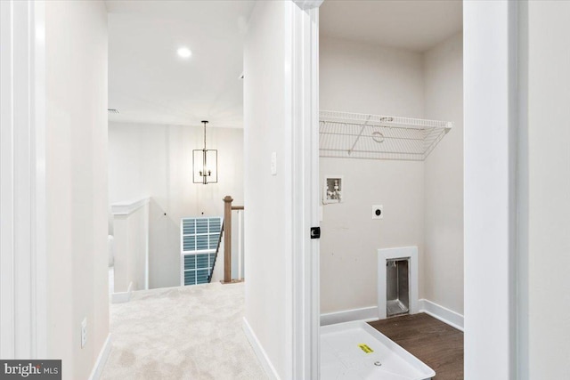 clothes washing area featuring laundry area, baseboards, hookup for an electric dryer, carpet floors, and washer hookup