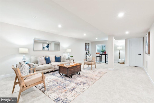 living area featuring light carpet, baseboards, and recessed lighting