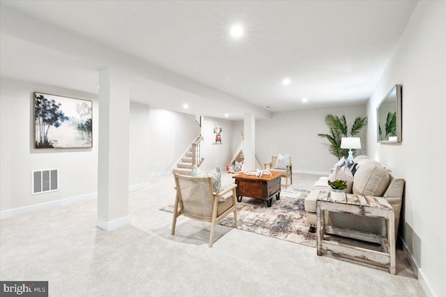 living room with recessed lighting, visible vents, stairway, and baseboards