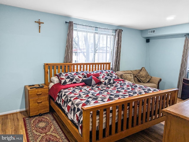 bedroom featuring dark wood-type flooring