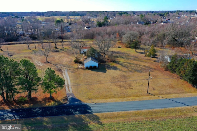 birds eye view of property featuring a rural view