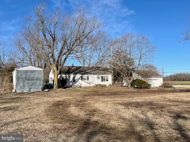 back of property with a lawn