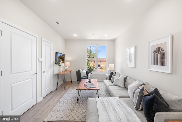 living room with light hardwood / wood-style floors