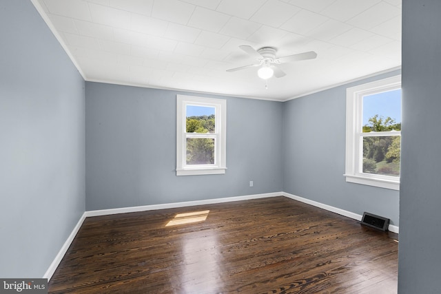 spare room featuring ornamental molding, ceiling fan, and dark hardwood / wood-style flooring