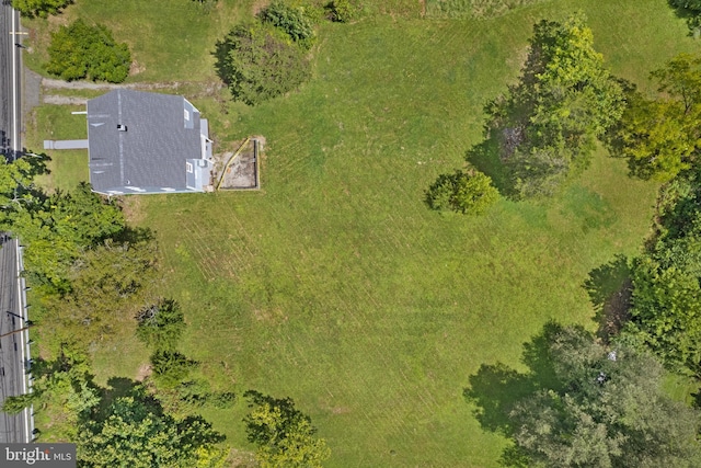 birds eye view of property featuring a rural view