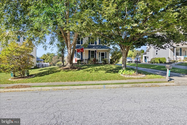 view of front facade with a porch and a front yard