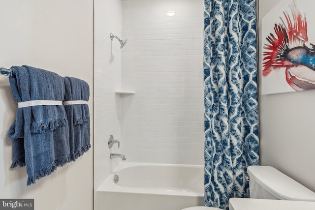 bathroom with shower / bathtub combination with curtain and toilet