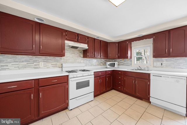 kitchen featuring sink, white appliances, light tile patterned floors, and backsplash