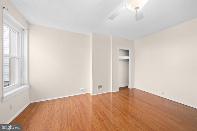 interior space with ceiling fan and light hardwood / wood-style flooring