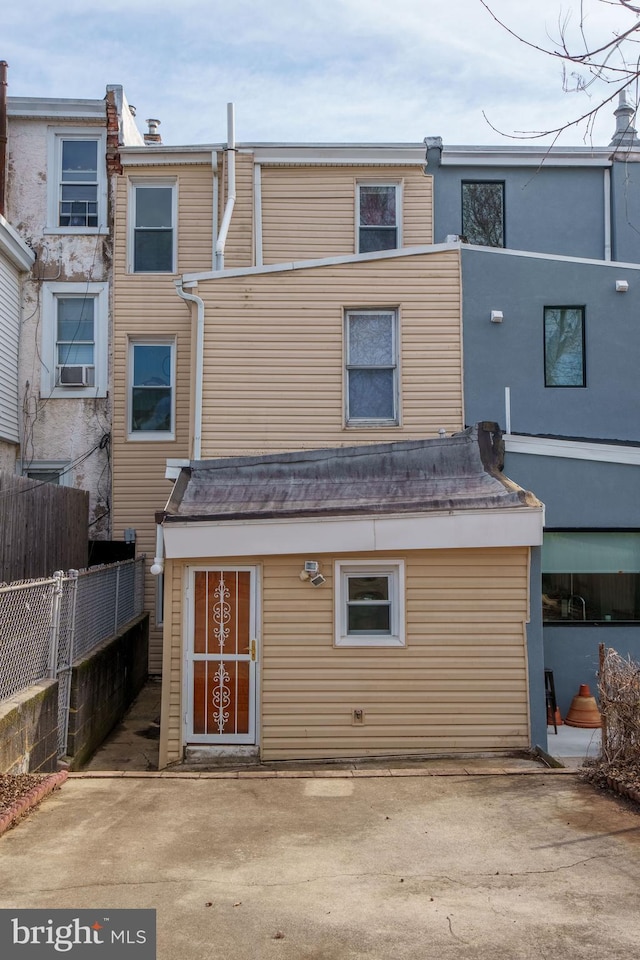 back of property with cooling unit