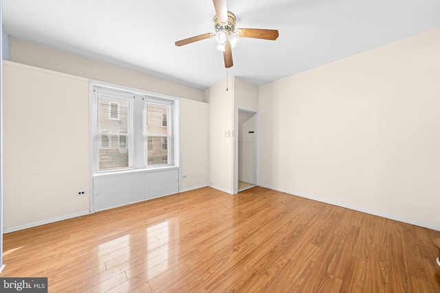 unfurnished room featuring light hardwood / wood-style floors and ceiling fan