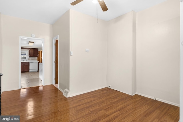 unfurnished room with ceiling fan and light wood-type flooring