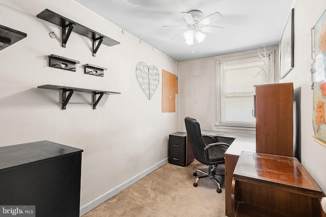 carpeted home office with ceiling fan