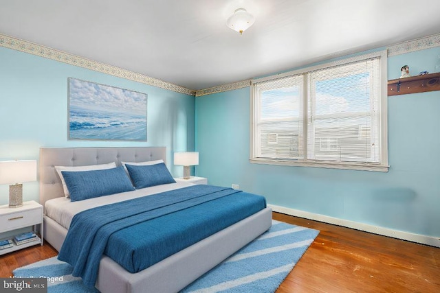 bedroom featuring wood-type flooring