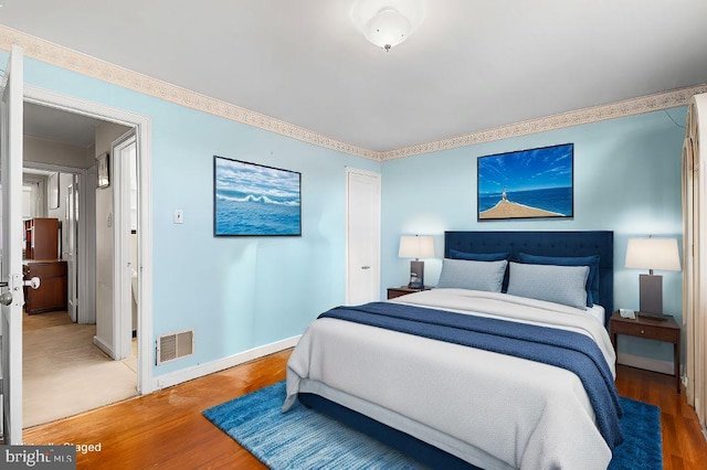 bedroom featuring hardwood / wood-style floors