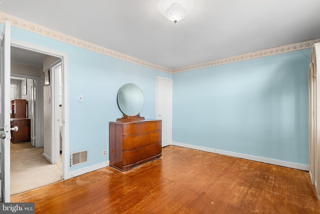 empty room with hardwood / wood-style floors