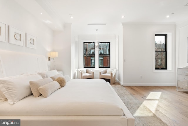 bedroom featuring ornamental molding, recessed lighting, baseboards, and light wood finished floors