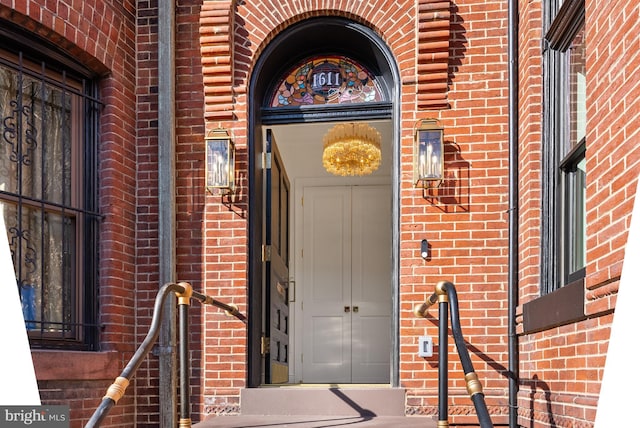 entrance to property with brick siding