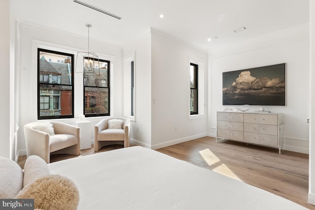 bedroom with baseboards, ornamental molding, wood finished floors, and recessed lighting