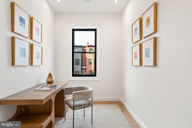 office space with light wood-type flooring, baseboards, and recessed lighting