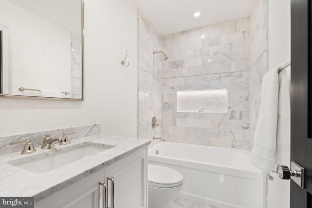 bathroom with shower / bath combination, vanity, and toilet