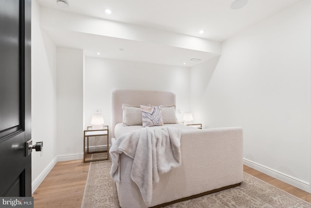 bedroom with recessed lighting, light wood-style flooring, and baseboards