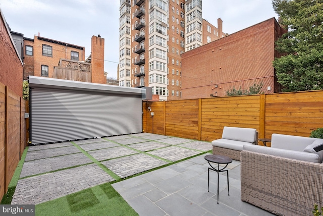 view of patio / terrace featuring fence